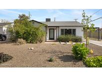 Charming single-story home with desert landscaping and inviting front entrance at 1615 E Roma Ave, Phoenix, AZ 85016