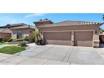 Charming home featuring a two-car garage and landscaped front yard in a sunny neighborhood at 1621 W Wildwood Dr, Phoenix, AZ 85045