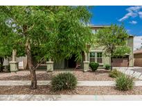 Charming two-story home with landscaped front yard and inviting entrance, showcasing curb appeal at 1915 S Ponderosa Dr, Gilbert, AZ 85295