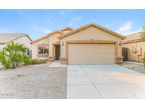Charming single-story home with a two-car garage, desert landscaping, and a welcoming facade at 2783 E Mineral Park Rd, San Tan Valley, AZ 85143