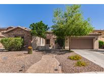 Charming single-Gathering home featuring a stone facade, manicured landscaping and a brick pathway at 850 W Folley St, Chandler, AZ 85225