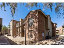 Multi-Gathering exterior featuring brick facade and a convenient handicap parking space at 200 E Southern Ave # 368, Tempe, AZ 85282