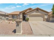 Inviting single story home with desert landscaping and a two-car garage at 3755 N 151St Ave, Goodyear, AZ 85395
