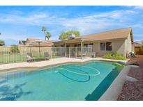 Sparkling pool with a well-maintained backyard, perfect for outdoor enjoyment and relaxation at 4213 W Calle Lejos --, Glendale, AZ 85310