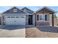 Charming single-Gathering home featuring a two-car garage, brick accents, and desert landscaping at 4732 S 38Th Gln, Phoenix, AZ 85041
