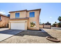 Two-story home featuring a two-car garage, desert landscaping, and a neutral color scheme at 5401 N 104Th Dr, Glendale, AZ 85307