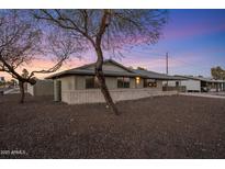 Charming single-story home with mature trees and desert landscaping for low maintenance at 6802 E Oak St, Scottsdale, AZ 85257