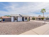 Charming single-story home featuring a low maintenance desert landscaped front yard at 733 W El Prado Rd, Chandler, AZ 85225