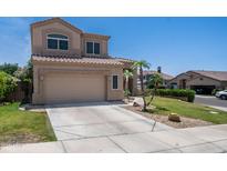 Charming two-story home with landscaped front yard, desert landscaping, and a concrete driveway at 853 W Hemlock Way, Chandler, AZ 85248