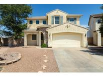Charming two-story home features a two-car garage and stone accents at 1106 E Altadonna St, San Tan Valley, AZ 85140