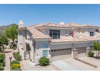 Charming two-story home with a tile roof, private gated patio and a two car garage at 1747 E Northern Ave # 104, Phoenix, AZ 85020