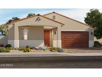Beautiful single-story home featuring a covered entry, desert landscaping, and a two-car garage at 17567 W Pierson St, Goodyear, AZ 85395