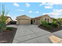Charming home featuring a three-car garage, desert landscaping, and a tile roof at 27308 N 56Th Dr, Phoenix, AZ 85083