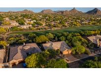 Stunning aerial view of property nestled by golf course, landscaping, and mountain views at 28897 N 94Th Pl, Scottsdale, AZ 85262