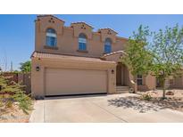 Charming two-story home featuring a red tile roof, three arched windows, and a spacious two-car garage at 3381 E Canary Way, Chandler, AZ 85286