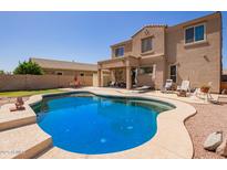 Gorgeous outdoor pool with a tanning ledge and plenty of space for entertaining at 3381 E Canary Way, Chandler, AZ 85286