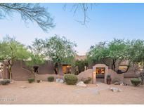 Charming single-story home featuring a neutral stucco exterior, desert landscaping, and a private entrance at 3405 E Knox Rd, Phoenix, AZ 85044