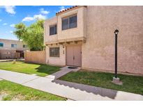 Charming two-story townhouse with a well-maintained lawn and neutral paint at 600 S Dobson Rd # 178, Mesa, AZ 85202