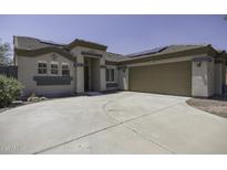 Inviting single-story home featuring a neutral color palette, a two-car garage, and well-maintained landscaping at 651 W Cobblestone Dr, Casa Grande, AZ 85122