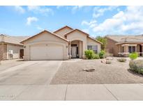 Charming single-story home with a well-manicured desert landscape and a two-car garage at 871 N Granada Dr, Chandler, AZ 85226