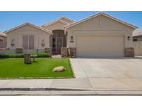 Charming single-story home featuring a well-manicured lawn and neutral-toned exterior at 9563 E Keats Ave, Mesa, AZ 85209
