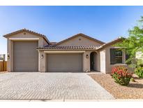 Charming single-story home with a three-car garage and well-maintained desert landscaping at 1736 E Joelle Dr, Casa Grande, AZ 85122