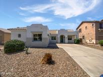 Charming single-story home with a well-maintained front yard and a welcoming entrance at 19973 E Thornton Rd, Queen Creek, AZ 85142