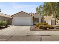 Charming single-story home featuring a two-car garage and low maintenance desert landscaping at 2625 E Beverly Rd, Phoenix, AZ 85042