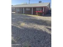 Charming single-story brick home with a gravel front yard and covered porch, located in a quiet neighborhood at 3226 W Maryland Ave, Phoenix, AZ 85017