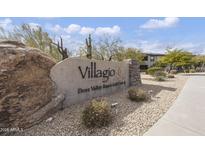 Welcoming Villagio at Dove Valley Ranch Golf Club entrance sign with desert landscaping at 33575 N Dove Lakes Dr # 2033, Cave Creek, AZ 85331