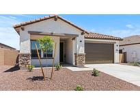 Charming single-Gathering home featuring a tile roof and a two-car garage at 3913 S 233Rd Ln, Buckeye, AZ 85326