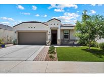 Charming single-story home with a well-manicured lawn and covered patio area at 5341 W Alta Mesa Ave, Laveen, AZ 85339