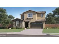 Charming two-story home with a blend of stucco and stone facade, attached garage, and inviting curb appeal at 8323 E Petunia Ave, Mesa, AZ 85212
