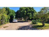 Spacious driveway with mature trees providing ample shade and parking at 8527 W Jefferson St, Peoria, AZ 85345