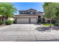 Attractive two-story home featuring a three-car garage, neutral color scheme, and well-maintained landscaping at 965 E Virgo Pl, Chandler, AZ 85249