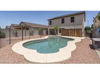 Backyard featuring a private in-ground pool surrounded by desert landscaping at 12424 N B St, El Mirage, AZ 85335