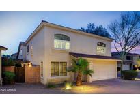 Charming two-story home with a two-car garage, well-maintained landscaping, and inviting curb appeal at 15550 N Frank Lloyd Wright N Blvd # 1040, Scottsdale, AZ 85260