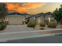 Charming single-story home with a three-car garage, desert landscaping, and a warm, inviting curb appeal at 2513 E Pleasant Ln, Phoenix, AZ 85042