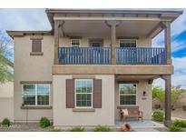 Charming two-story home showcasing a cozy front porch and well-maintained landscaping at 29491 N 122Nd Gln, Peoria, AZ 85383
