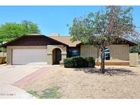 Attractive single-story home with brick exterior, and a well-maintained front yard at 6504 W Cochise Dr, Glendale, AZ 85302
