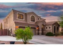 Stunning two-story home with a tile roof, three-car garage, and drought-resistant landscaping at 654 E Taylor Trl, San Tan Valley, AZ 85143