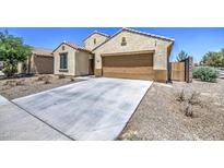 Charming single-story home with a well-manicured yard and a spacious two-car garage in a desirable neighborhood at 10548 W Crown King Rd, Tolleson, AZ 85353