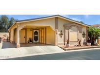 Charming single-story home featuring covered parking, desert landscaping, and textured stucco facade at 1640 E Augusta Ave, Chandler, AZ 85249