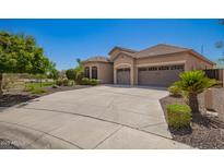 Charming single-Gathering home with a spacious driveway and well-manicured landscaping in a peaceful neighborhood at 22304 N 104Th Ln, Peoria, AZ 85383