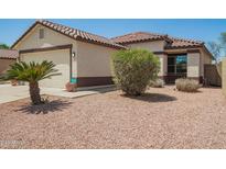 Charming single-story home featuring a tile roof, two-car garage, and low maintenance desert landscaping at 3032 W Red Fox Rd, Phoenix, AZ 85083