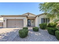Charming single-story home with manicured landscaping and a welcoming blue front door at 3280 E Coconino Dr, Gilbert, AZ 85298