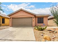 Charming single-story home featuring a xeriscaped front yard and a two-car garage at 3353 E Blackhawk Dr, Phoenix, AZ 85050