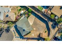 Bird's-eye view of property showing the layout of the house, shed, and surrounding yard at 3944 W Wilshire Dr, Phoenix, AZ 85009