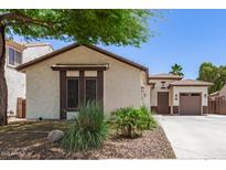 Charming single-story home with stucco exterior, desert landscaping, and a spacious two-car garage at 6805 S Sapphire Way, Chandler, AZ 85249