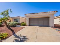 Charming home featuring a two-car garage and low-maintenance desert landscaping at 12910 W Junipero Dr, Sun City West, AZ 85375